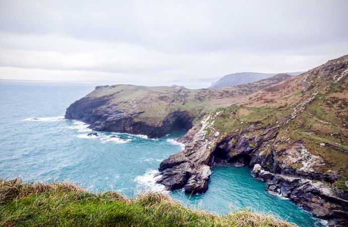 Airview Photography Of Mountain Cliffs Near Ocean Photo