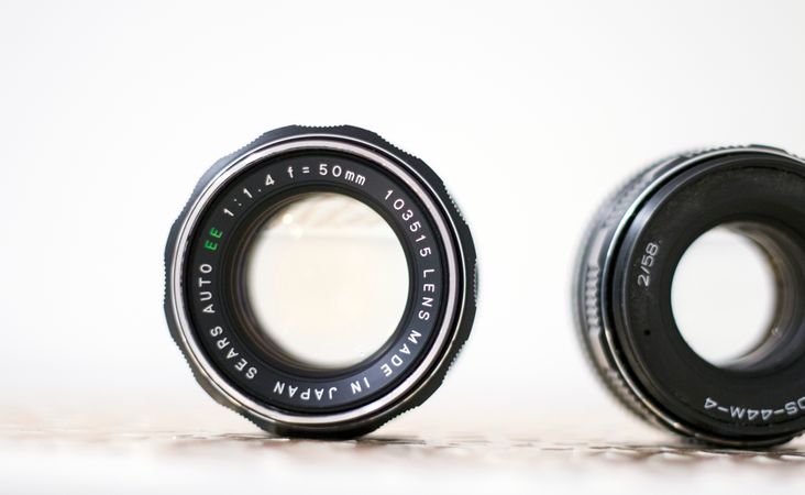 Analog Camera Lens On White Surface Photo