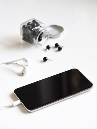 Apple Earphones With Black Iphone Photo