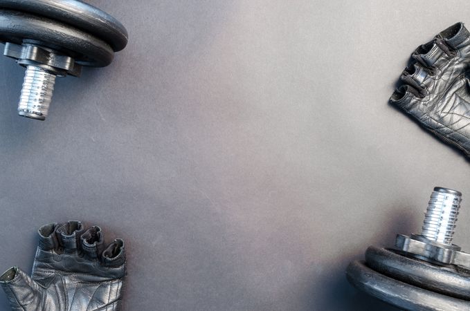 Barbells On Gray Surface With Black Hand Gloves Photo