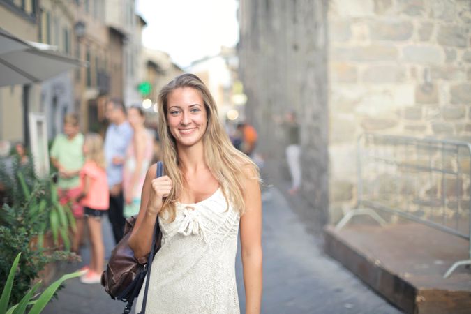 Beautiful Girl Wearing White Dess On Street Photo