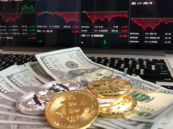 Bitcoins On Banknotes Photo