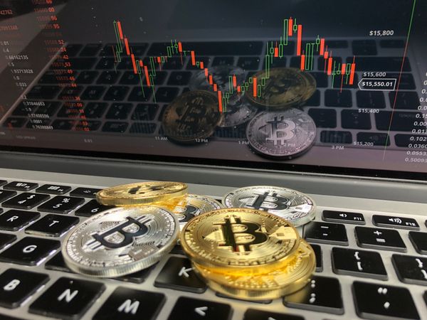 Bitcoins On Keyboard Photo
