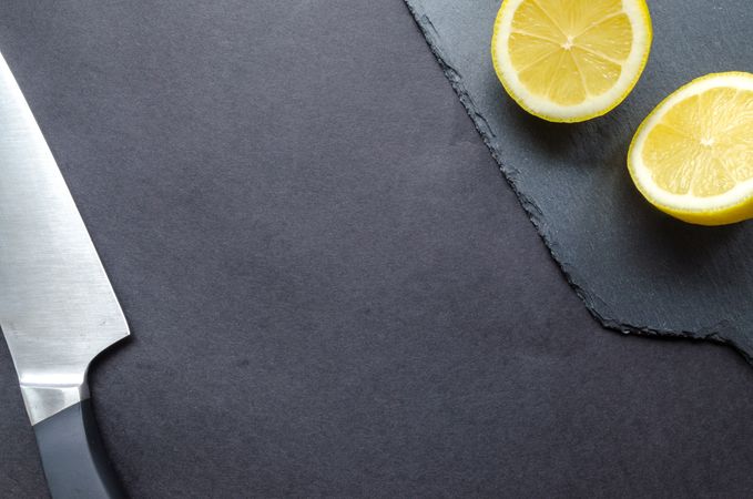 Black Knife With Sliced Lemon Photo