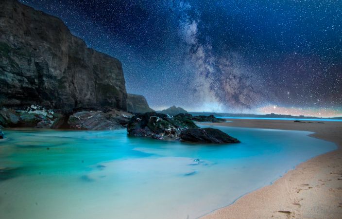 Black Stone On Body Of Water During Nighttime Photo