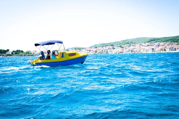 Blue And Yellow Boat In Croatia Ocean Photo