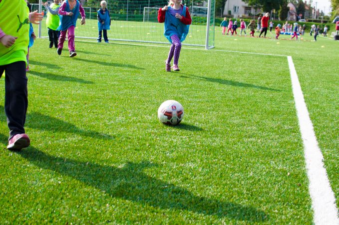 Boy Is Running To Kick Football Photo