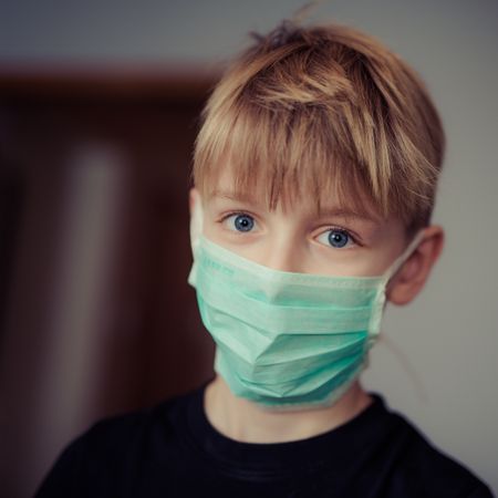 Boy Wearing Surgical Mask Photo
