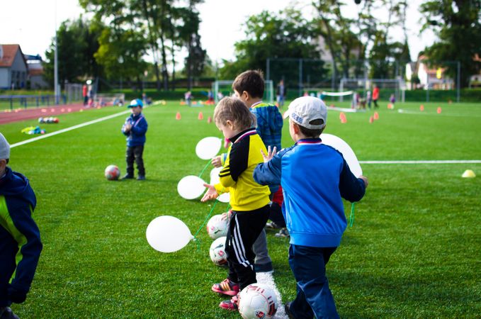 Boys Exercise With White Balloons Photo