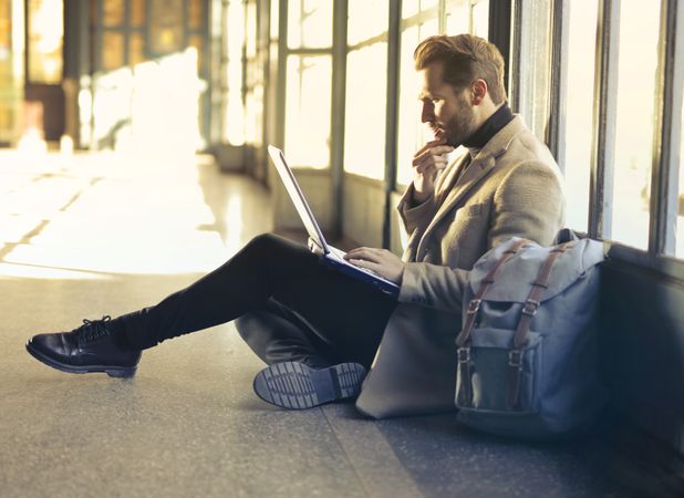 Brown Haired Man Using Laptop Computer Photo