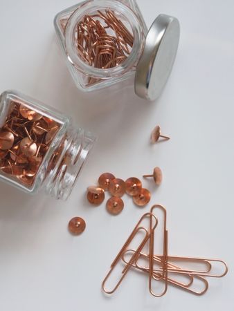 Brown Thumb Tacks And Paper Clips Photo