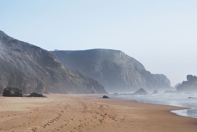 Calm Coast And Brown Sand Photo