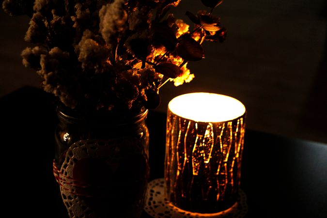 Candle Light Near Flower Vase Photo