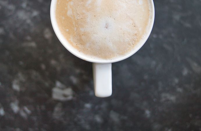 Cappuccino Coffee Cup On Black Marble Photo
