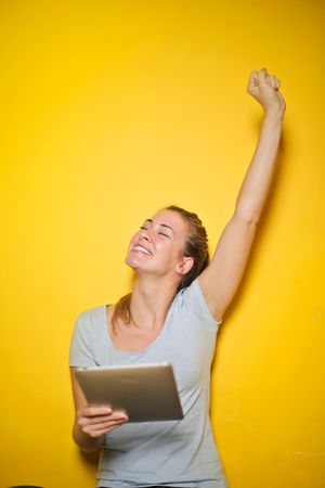 Cheerful Woman Holding Ipad Photo