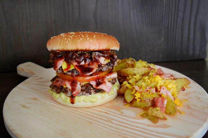 Cheeseburger Served On Wooden Plate Photo