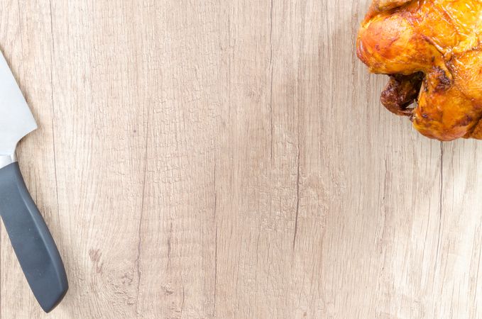 Chicken And Knife On Chopping Board Photo