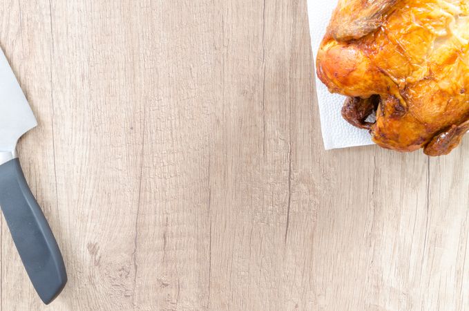 Chicken And Knife On Chopping Board Photo