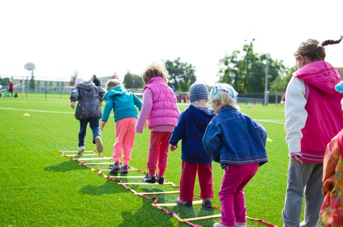Children Doing Action Activity For Football Warmup Photo
