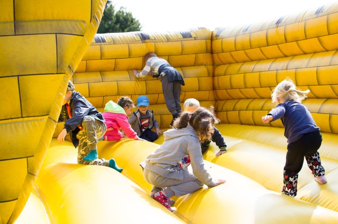 Children's Playing In Yellow Jumper Photo