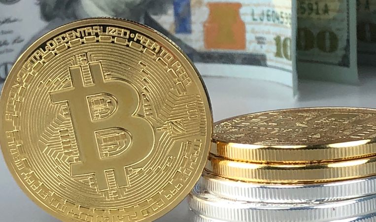 Close-up Of Gold Bitcoin Photo