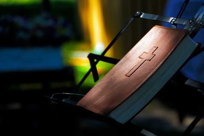 Close-up Of Holy Bible At Night Photo