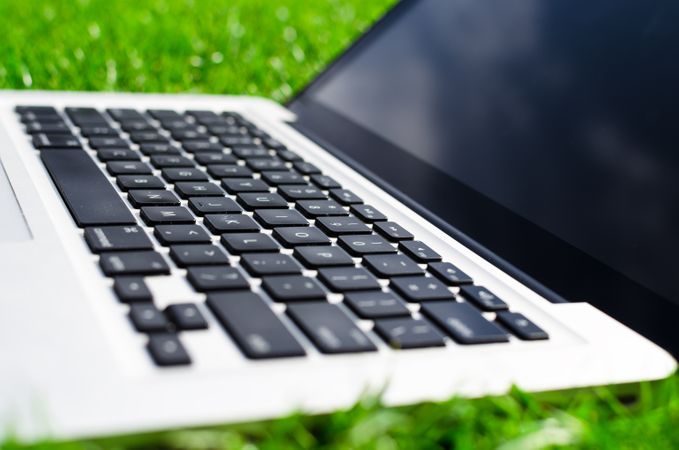 Close Up Of Macbook In Lawn Photo