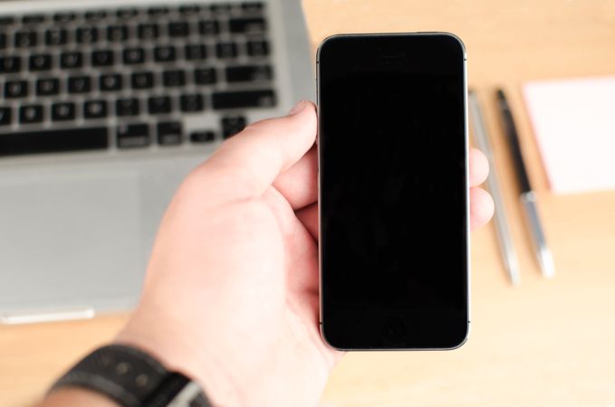 Close-up Photo Of Man Holding Iphone Photo