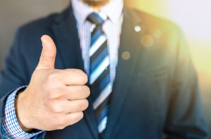 Close-up Photo Of Man Wearing Black Suit Jacket Doing Thumbs Up Gesture Photo