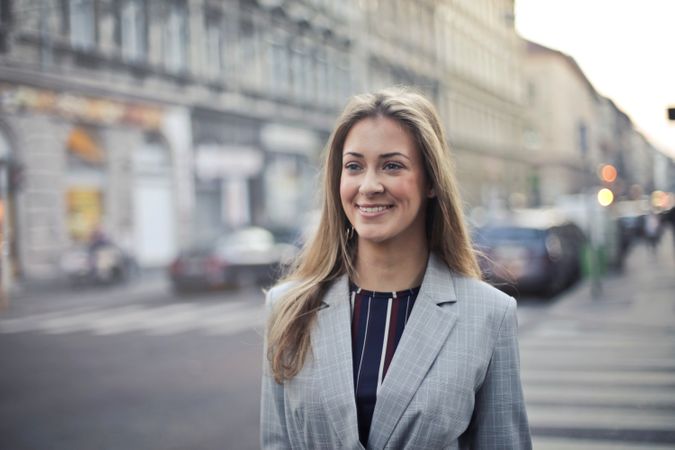 Close-up Photography Of A Woman Wearing Formal Coat Photo