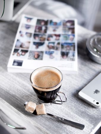 Close-up Photography Of Coffee In Wooden Desk Photo