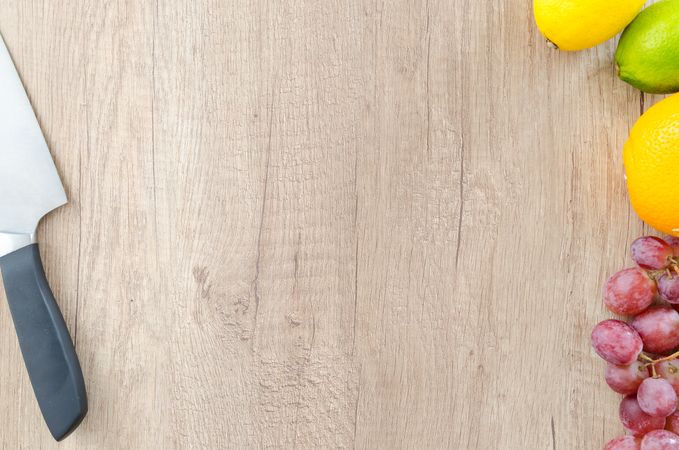 Delicious Citrus Fruits On Chopping Board With Knife Photo