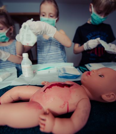 Doll With Three Siblings Playing Doctor Doctor Photo