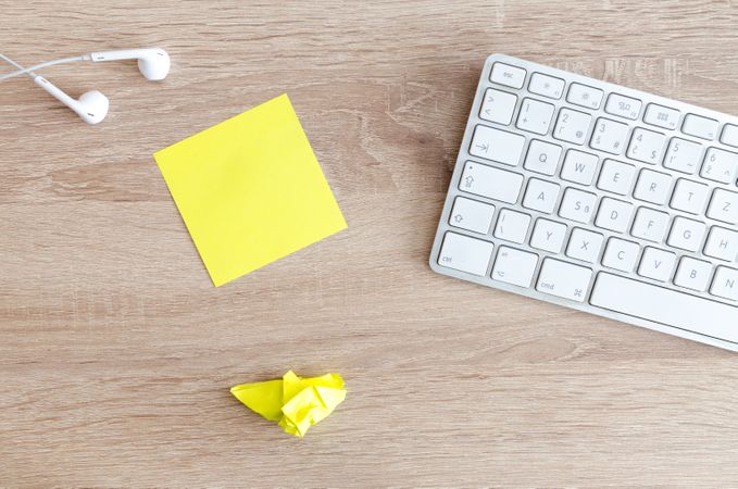 Earphones,Keyboard,Sticky Notes On Table Photo