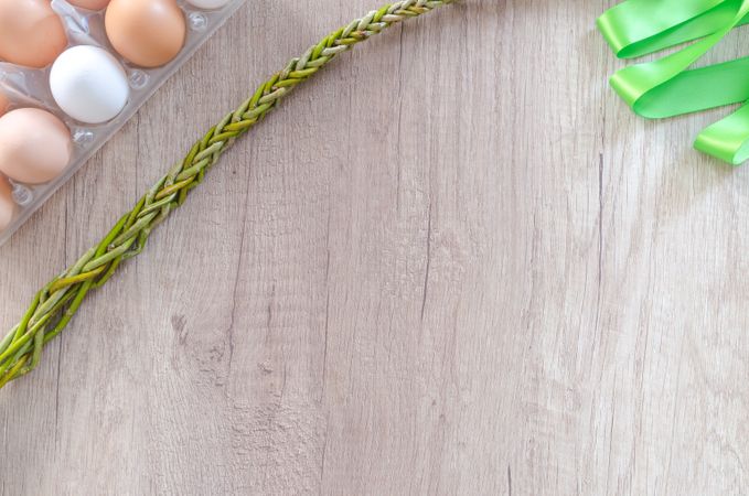 Eggs In Tray Beside Chain And Green Ribbon Photo