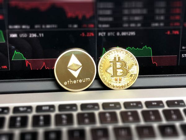 Ethereum And Bitcoin Emblems Photo