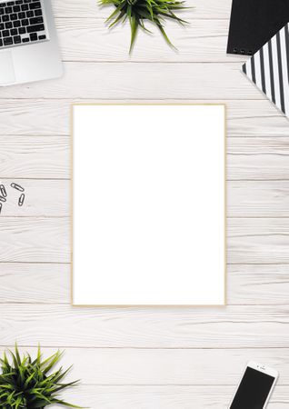 Flat-lay Photography Of Brown Photo Frame Near Laptop Photo
