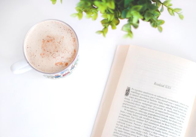 Flatlay Photography Of Book And Cup Photo