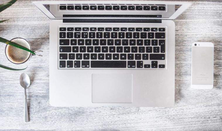 Flatlay Photography Of Desk With Mac, Iphone And Cup Of Tea Photo