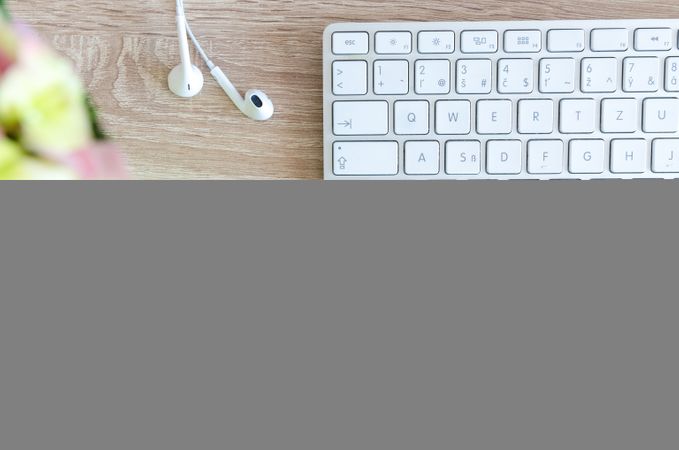 Focused White Keyboard And Earphone Photo