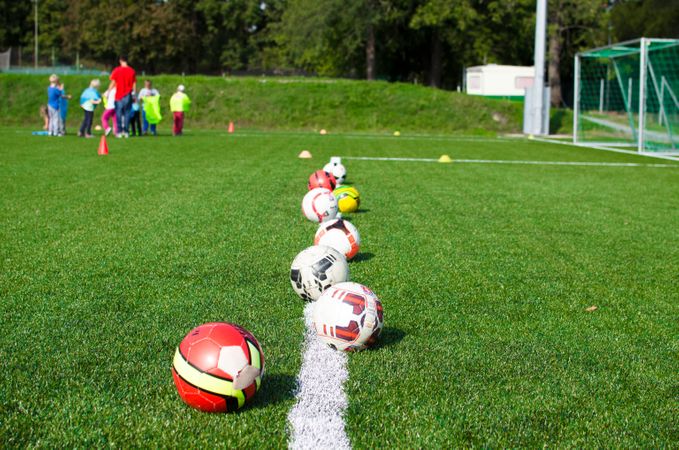 Footballs In Rows On Play Ground Photo