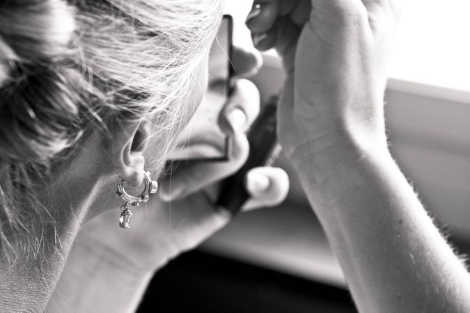Girl Doing Eye Linear On Her Wedding Photo