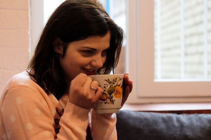 Girl Having Coffee In Morning On Couch Photo