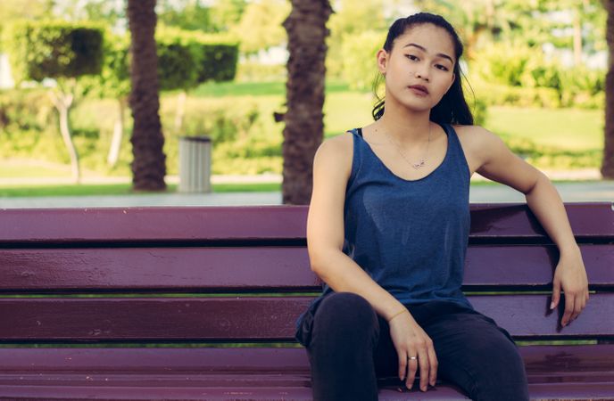 Girl Sitting On Park Bench Photo