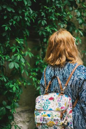 Girl Wearing Backpack Walking In Street Photo