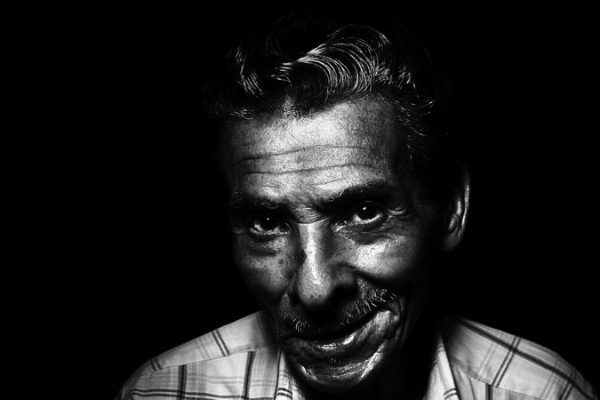 Grayscale Photo Of Man Smiling Photo