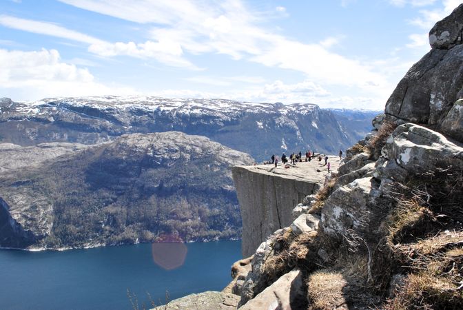 Group Of People On Top Of Mountain During Daytime Photo