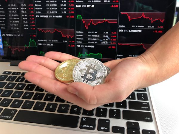 Hand Holding Bitcoins Photo