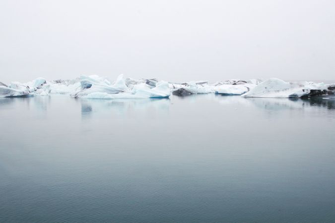 Landscape Photography Of Body Of Water Near Ice Berg Photo