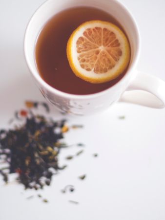 Lemon Tea On White Surface Photo